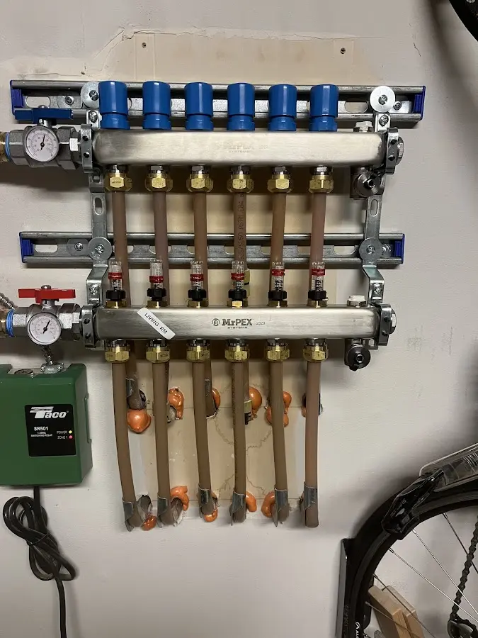 Plumber performing Water Heater Repair at a residential property in Hibbing